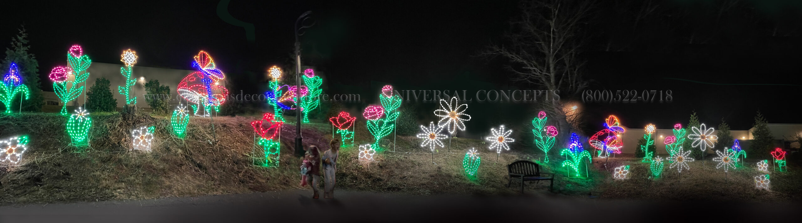 a field of LED flower silhouettes adorn the path at Pigeon Forge during Christmas 2023.