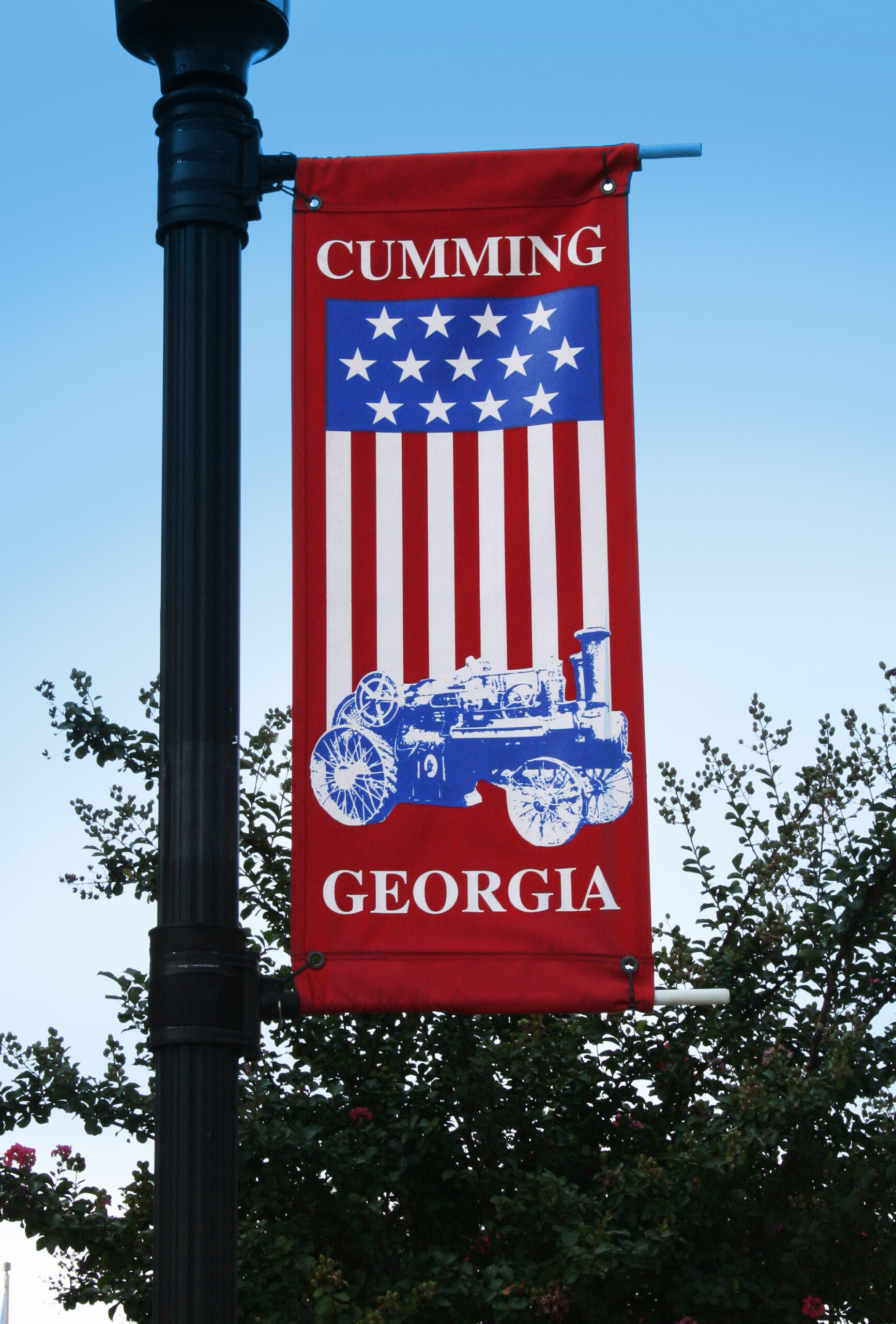 a city banner on a lamppost